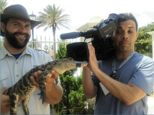 Joel with a camcorder style camera
